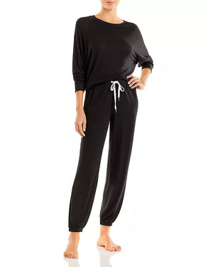 Black loungewear set with a long-sleeve top and jogger pants on a white background