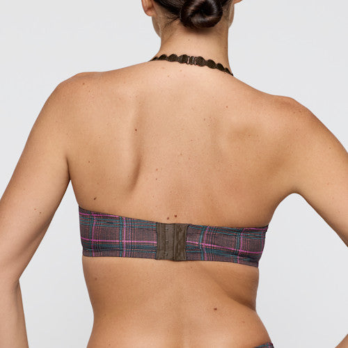 Plaid-patterned bandeau top worn by a person on a plain background